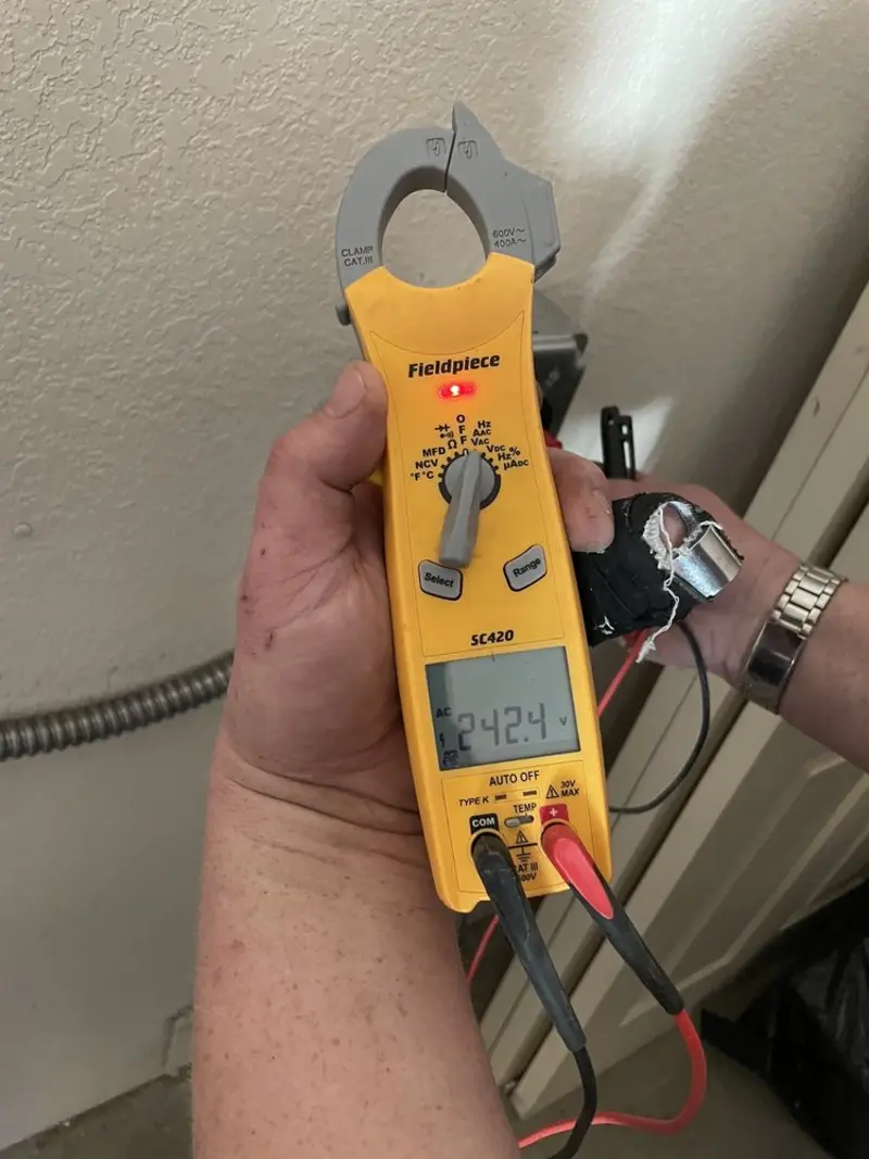 Voltage testing with clamp meter during Generator Installation in Miami Beach